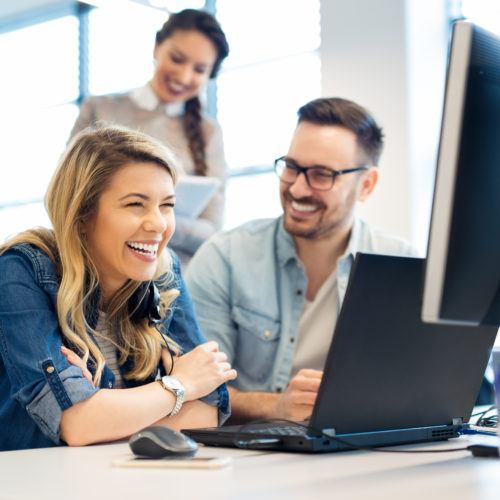 Group of business people and software developers working as a team in office